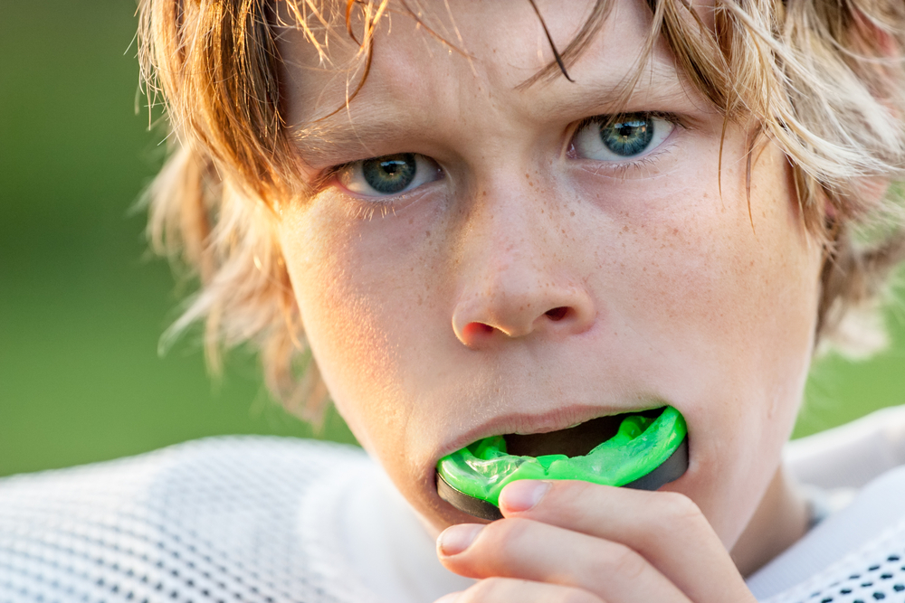 Common concussion myth: boy inserting football mouthguard will be safe