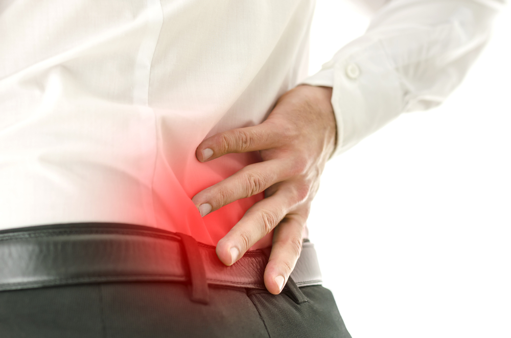 Man suffers from lower back pain needs treatment for sciatica in Guelph